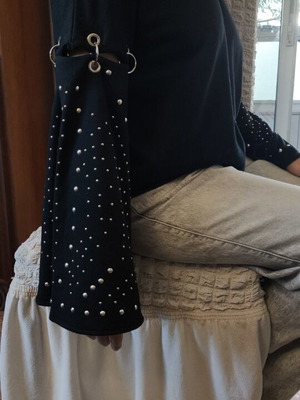 Black sweater with rings like new