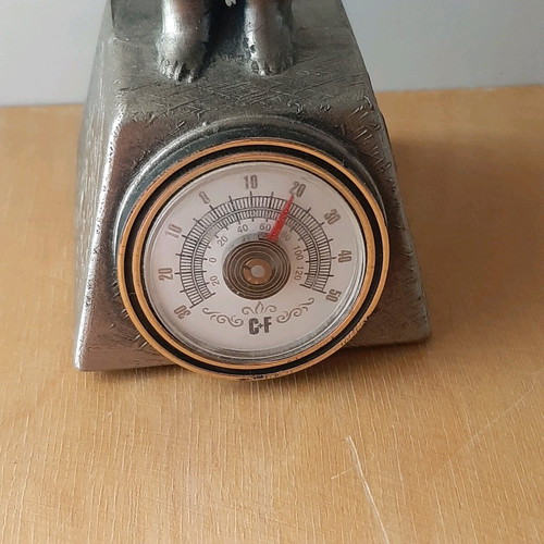 Vintage metal thermometer with small child figure like new
