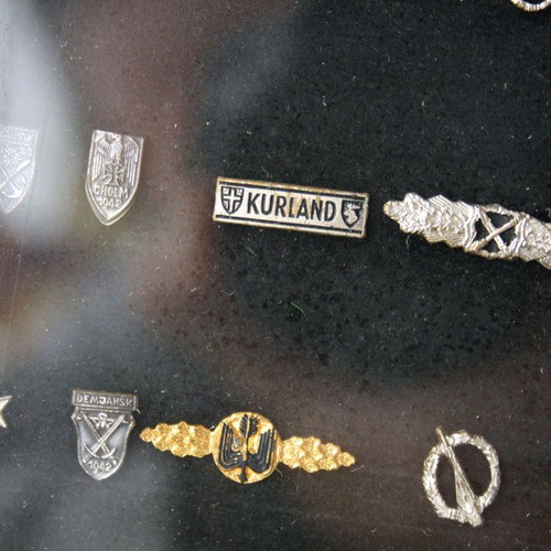 Frame with 27 old German Nazi military badges from World War II like new