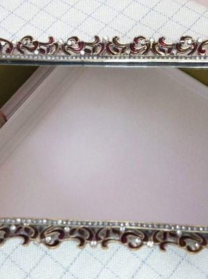 Vintage serving tray used with mirror surface and burgundy enamel floral design