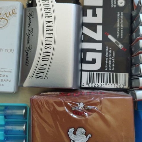 Vintage smoking collection with lighters, filters & rolling papers
