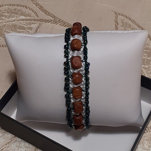 Handmade bracelet with brown wooden and green glass beads
