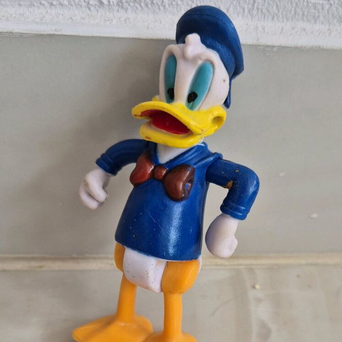 Donald Duck figure used with movable arms, legs, and head