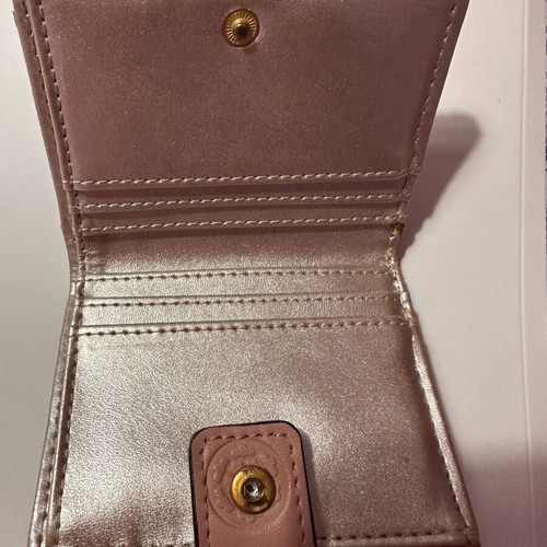 Guess wallet used, small size, pink with many compartments