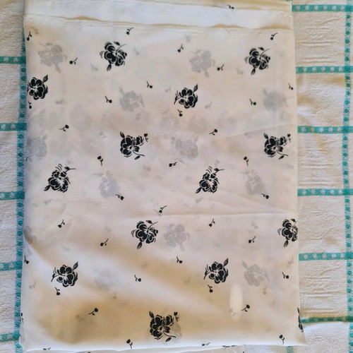 White fabric with black flowers for dress