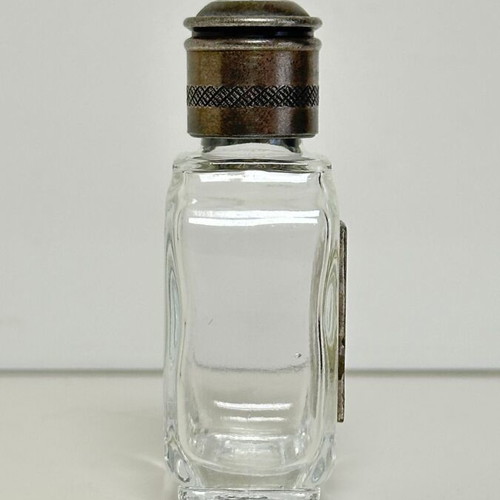 Vintage glass perfume bottle with metal decoration