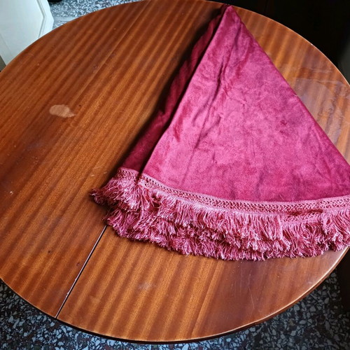 Round table with red tablecloth used, vintage wood design