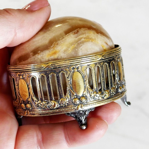Vintage decorative egg from natural onyx stone in carved silver-plated base used