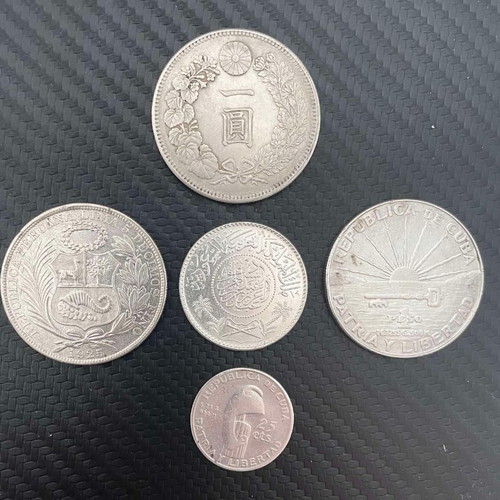 Silver coins from Cuba, Peru, Japan, Saudi Arabia