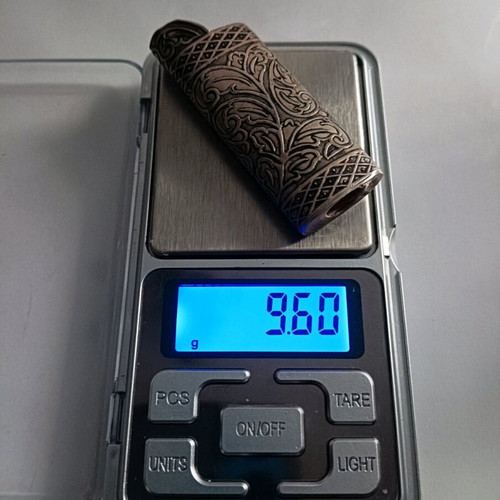 Vintage silver lighter case used with carved floral patterns