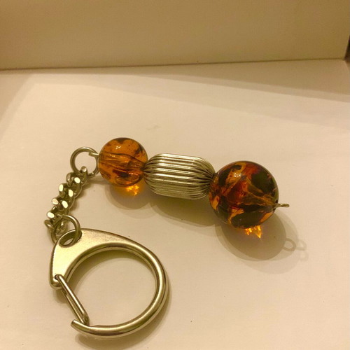 Keychain with metal elements and amber-type beads new, brown and silver