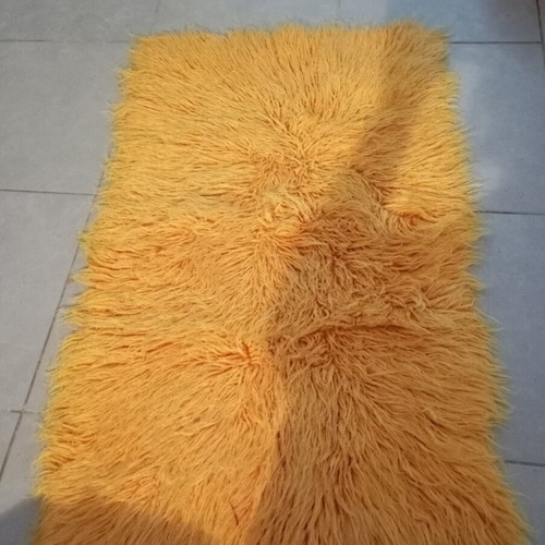 Orange flokati rug 70×110 cm