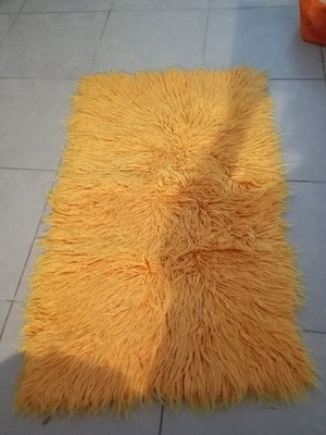 Orange flokati rug 70×110 cm
