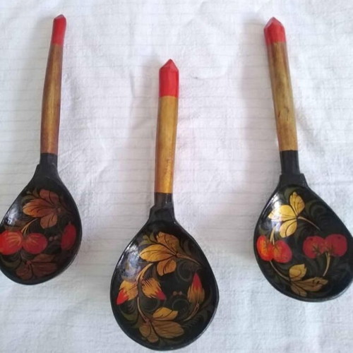 Set of three handmade wooden Russian spoons used, hand-painted
