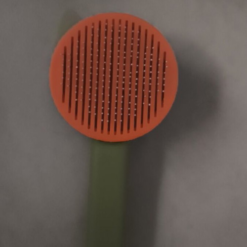 Cat grooming comb with hair removal button