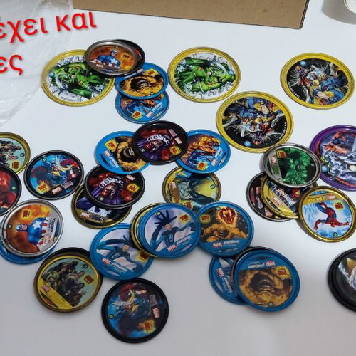 Various Pokémon and other collectible pogs