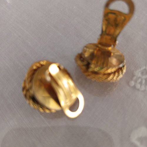 Vintage clip-on earrings used with gold embossed design and white pearl