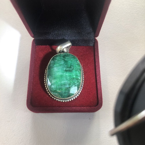 Necklace of smelted emerald like new with black ribbon