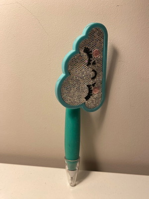 Pen used with cloud design in blue color