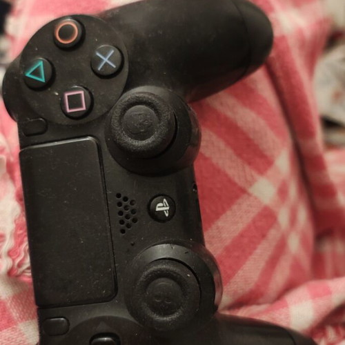 PlayStation controller used, somewhat worn but functional