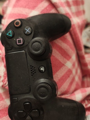 PlayStation controller used, somewhat worn but functional