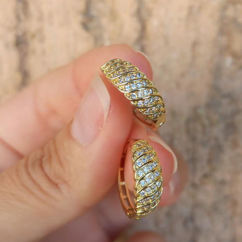 Gold-colored hoop earrings with white zircon stones, copper