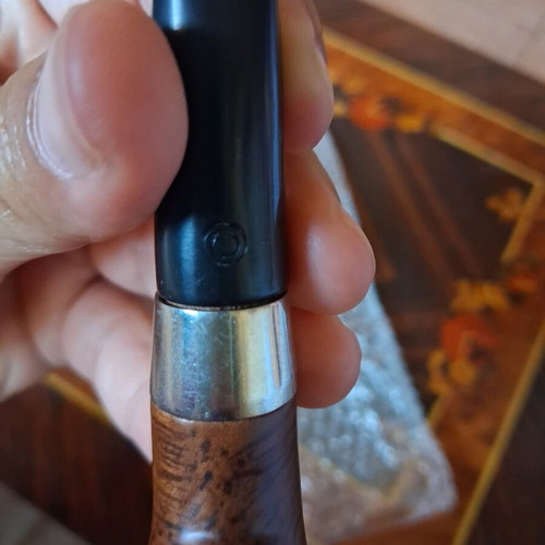 Vintage briar tobacco pipe with metal ring