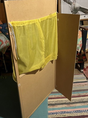 Used puppet theater with wear and missing support side