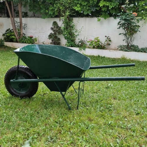 Garden wheelbarrow used with rust holes, sturdy frame and functional wheel