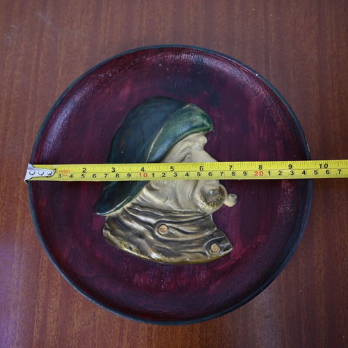 Vintage decorative wall plate with embossed male profile used