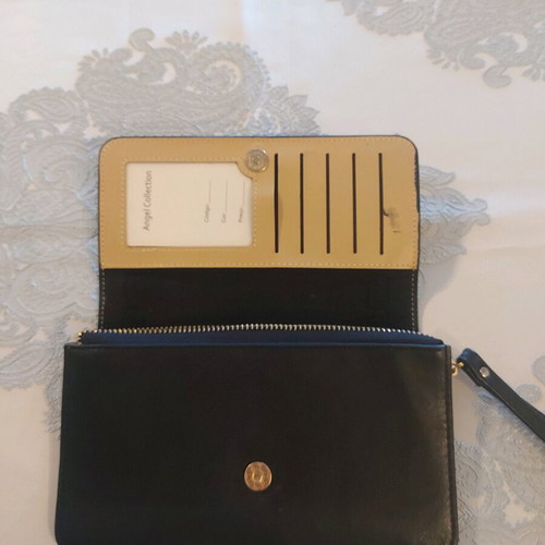 Women's wallet like new with discreet meander design black