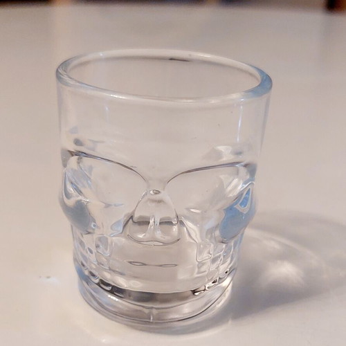 Collectible glass shot glass with 3D skull design like new