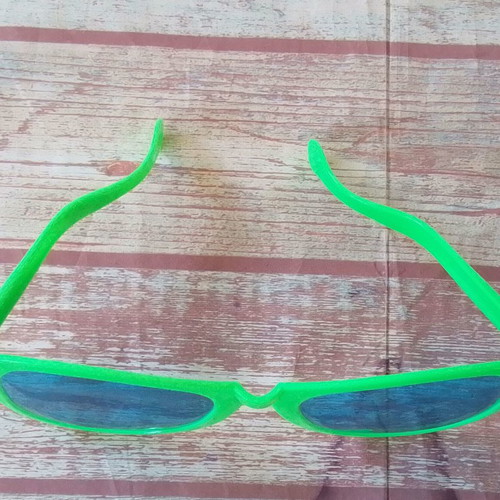 Plastic carnival giant green glasses used