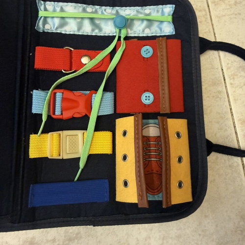 Montessori activity bag with dinosaur design, felt busy board