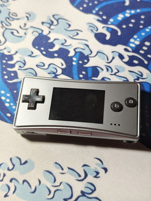 Gameboy Micro with new 2300mAh battery and USB charger