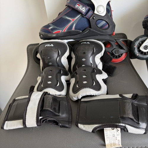 Fila roller skates refurbished with laces, velcro, and ankle buckle