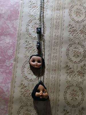 Gothic handmade necklace custom made with old doll heads