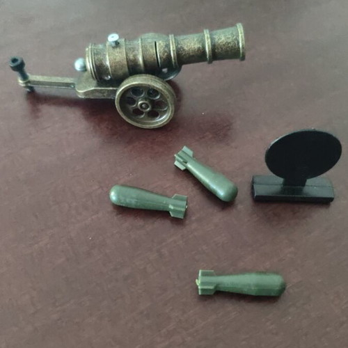 Metal decorative cannon replica with bronze finish and functional shells