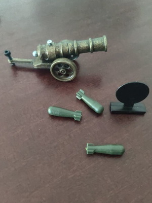 Metal decorative cannon replica with bronze finish and functional shells