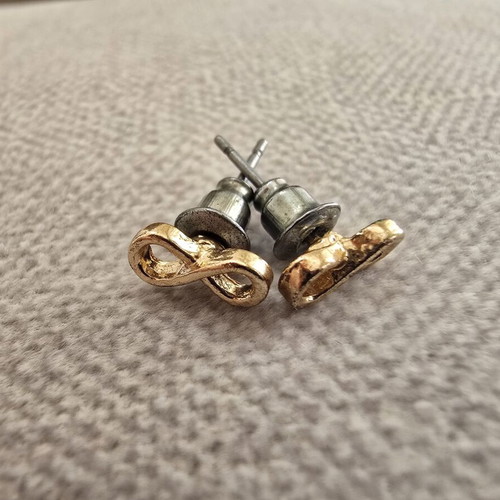 Infinity stud earrings in gold tone