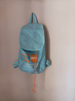 Set of seven multicolor bags including two blue backpacks and one black shoulder bag