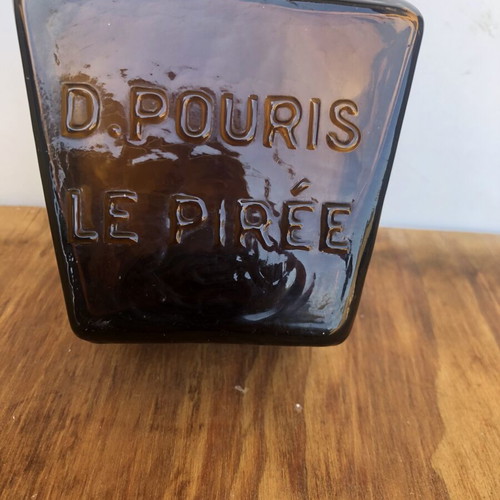 Antique glass bottle D.POURIS LE PIRÉE amber color