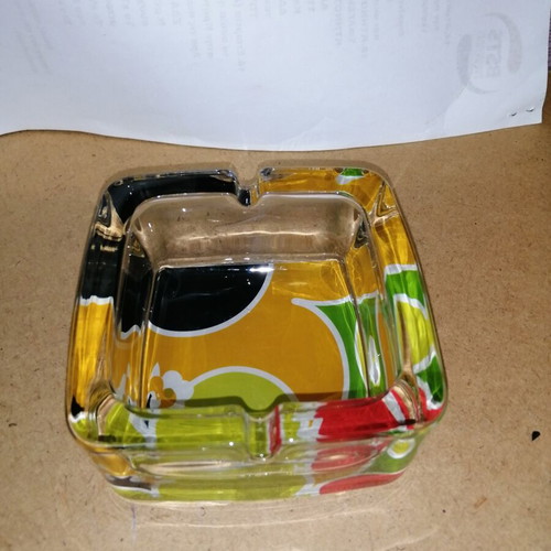 Glass ashtray with colorful bottom like new