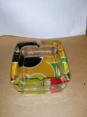 Glass ashtray with colorful bottom like new
