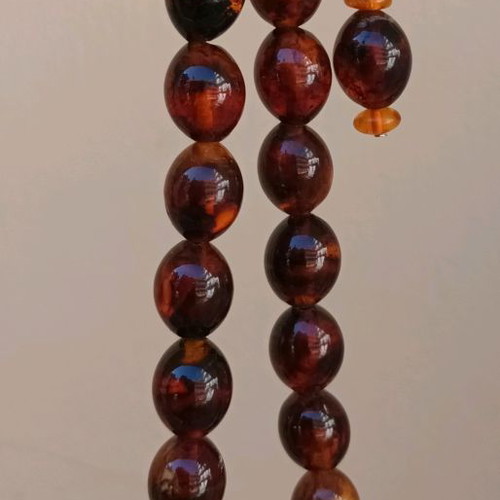 Pressed olive amber worry beads used, 38 g, 21 beads