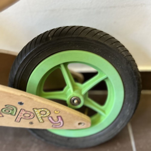 Wooden children's balance bike with extra rear wheel