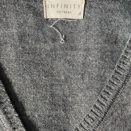 Knitted blouse with fringes like new, grey