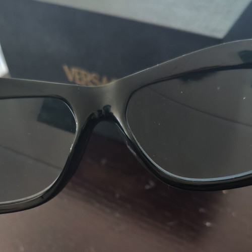 Versace collectible sunglasses, black lenses and frame
