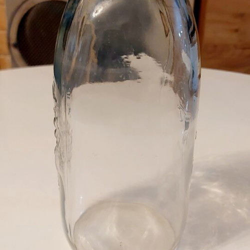 Glass bottle Frutta del Prato like new with embossed floral design