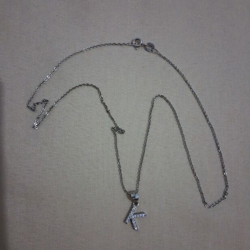 Necklace with letter K new, silver and gray